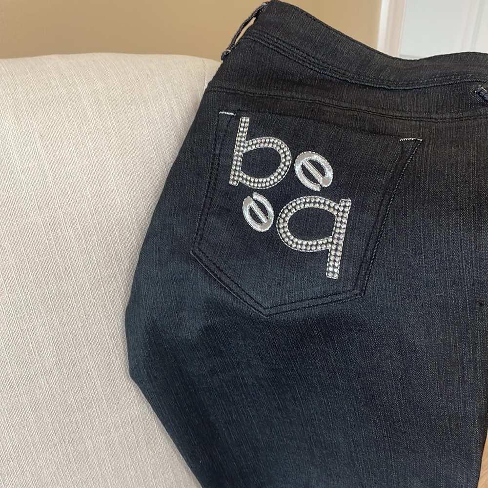 Bebe dark jeans with jeweled Bebe on back pockets! Never worn!